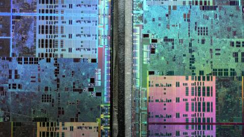 Abstract microscopic photography of a Graphics Processing Unit resembling a satellite image of a big city